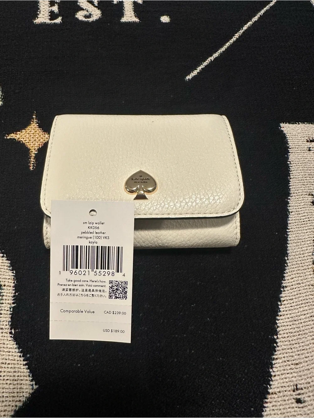 kate spade cream pebbled leather small zip wallet with gold spade emblem